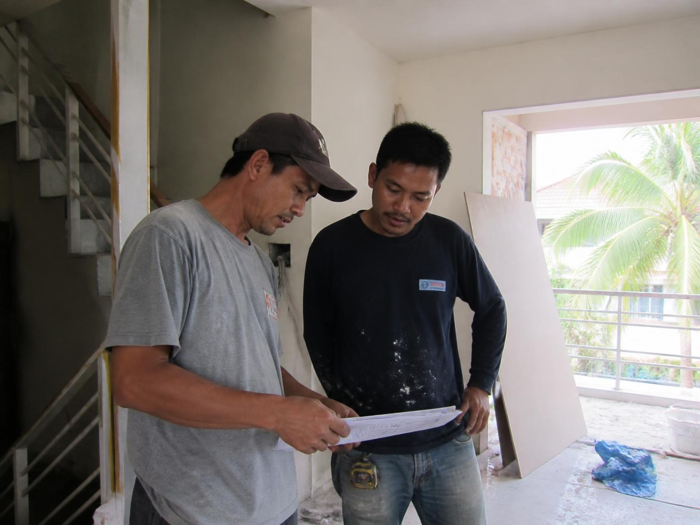 Bina Haus team reviewing works on a project site